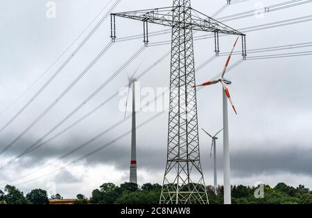 Power lines, high-voltage lines, wind power plants, grain field, northeast of Höxter, NRW, Germany Stock Photo