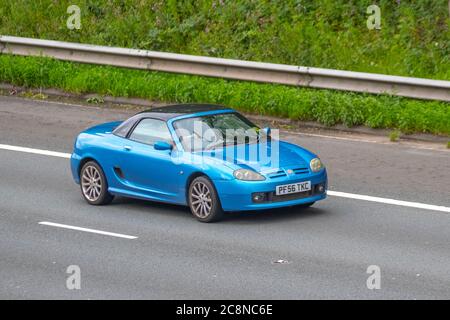 2007 MG MG TF Spark 135; Vehicular traffic moving vehicles, sportscars driving vehicle on UK roads, motors, motoring on the M6 motorway highway network. Stock Photo