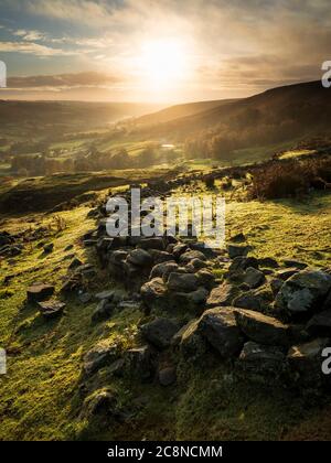 A view down into Rosedale along an old stone wall. Stock Photo