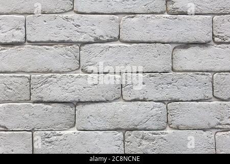 Seamless texture of white decorative stacked stone, natural stone cladding. brick background. close up. Background Stock Photo