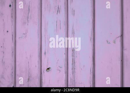 Light purple coloured background of aged wood with vertical planks. Stock Photo