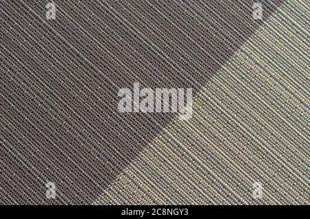 Abstract background from intertwined beige and purple threads. Texture of synthetic thread in beige and magenta colors. Multi-tasking background for d Stock Photo