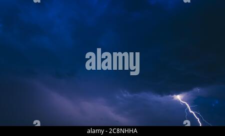 Lightning On Background Of Night Stormy Sky Before Rain. Cloudy Sky Stock Photo