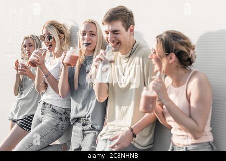 Group of young people having fun and gossiping