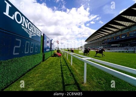Tenbury Wells ridden by jockey Robert 'Rab' Havlin (right) wins the Betfred Mobile Handicap Stakes at Ascot Racecourse. Stock Photo