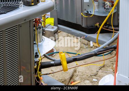 Install is checking new air conditioner system unit for a residential house Stock Photo