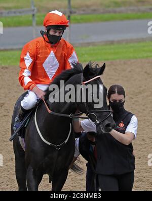 Jojo Rabbit and jockey Luke Morris after winning the Sky Sports Racing Sky 415 Novice Stakes at Wolverhampton Racecourse. Stock Photo