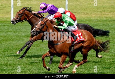 Tone The Barone ridden by jockey Harry Bentley (right) on their way to win the Play Nifty Fifty Exclusively At Betfair Handicap Stakes at Ascot Racecourse. Stock Photo