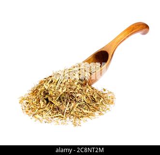 Capsella bursa-pastoris on a wooden spoon isolated on white. Stock Photo