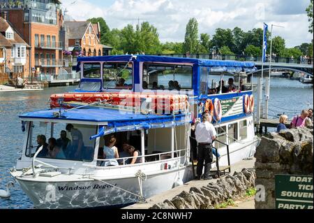 Windsor, Berkshire, UK. 26th July, 2020. Visitors to Windsor were back enjoying trips on the River Thames today in the warm morning sunshine before heavy downpours at lunchtime. Credit: Maureen McLean/Alamy Live News Stock Photo