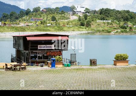 Kenyir, Malaysia - July 22, 2020: Houseboat is anchored in Kenyir Lake. Malaysia tourist attraction both for local and international. Stock Photo