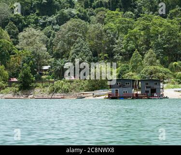 Kenyir, Malaysia - July 22, 2020: Houseboat is anchored in Kenyir Lake. Malaysia tourist attraction both for local and international. Stock Photo