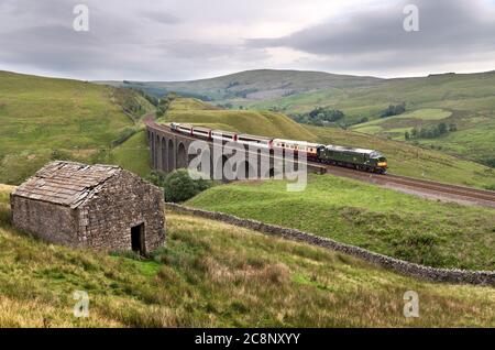 The Staycation Express Summer special train on the Settle-Carlisle railway at Arten Gill viaduct, Dentdale, Cumbria. Stock Photo