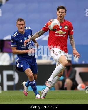 Leicester City's Jamie Vardy and Manchester United's Victor Lindelof (right) battle for the ball during the Premier League match at the King Power Stadium, Leicester. Stock Photo