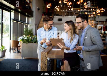 Business colleagues having conversation during coffee break Stock Photo