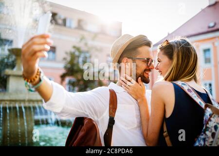 Beautiful couple in love travel, smiling, dating outdoors Stock Photo