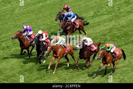 Tone The Barone ridden by jockey Harry Bentley (centre) on their way to win the Play Nifty Fifty Exclusively At Betfair Handicap Stakes at Ascot Racecourse. Stock Photo