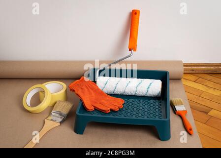 Painting Tools & Supplies. Roller Covers, Frames & Accessories, masking tape and Brushes Stock Photo