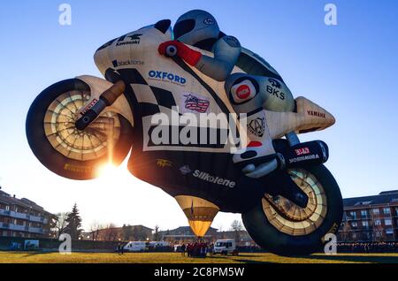 Mondovì, Italy - January 5, 2019: very big hot-air balloon shaped like a motorbike, just before the take off during the traditional epiphany festival Stock Photo