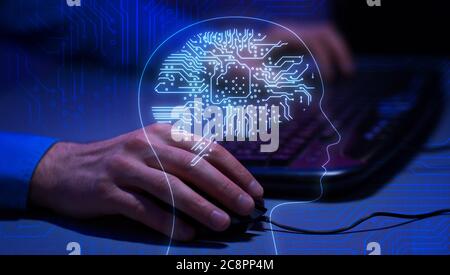 AI Concept. Human Silhouette With Electronic Brain Layered Over Man Using Laptop Stock Photo
