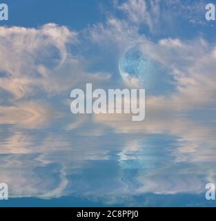 Daytime Moonrise over Tranquil Waters Stock Photo