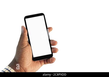 African man's hand holding a smartphone with a blank white screen, isolated on a white background. Cell phone mock up template with copy space. Stock Photo