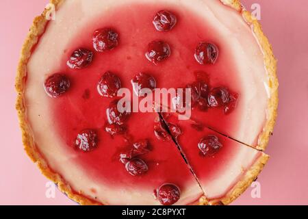 Plain cheesecake with cherry jelly on plate . Closeup view with copy space Stock Photo