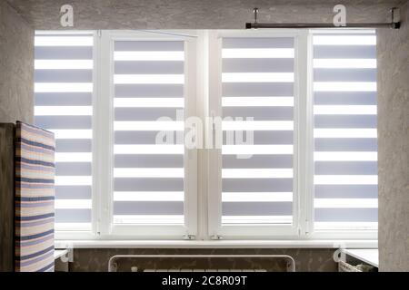 Windows with open modern horizontal blinds indoors, closeup Stock Photo
