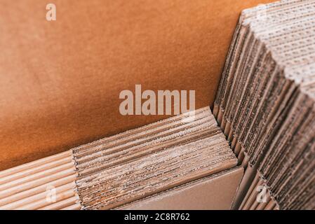 Home moving using corrugated cardboard boxes as protection material, detail. Stock Photo