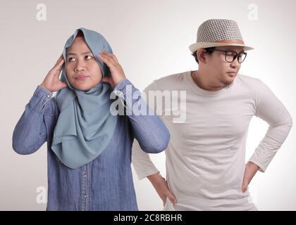 Young Asian muslim couple having bad relation, disappointed on each other, give up break or divorce concept Stock Photo