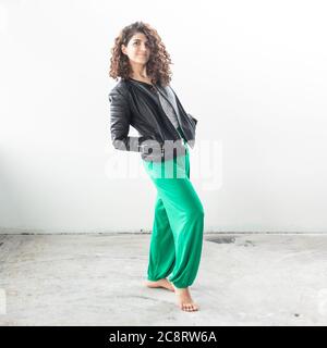 Fitness coach demonstrating stretches in studio Stock Photo