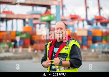 Hamburg, Germany. 16th July, 2020. Crane driver Torben Lehmann, recorded at Container Terminal Altenwerder in the Port of Hamburg. Credit: Daniel Reinhardt/dpa/Alamy Live News Stock Photo