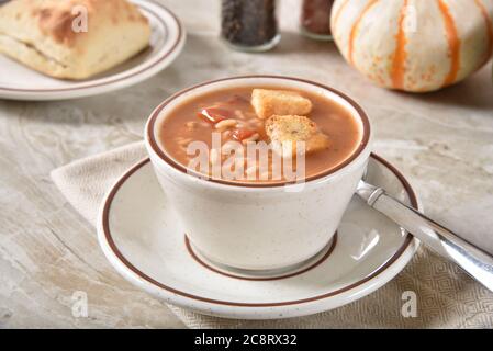 A cup of chicken rice gumbo with garlic croutons Stock Photo