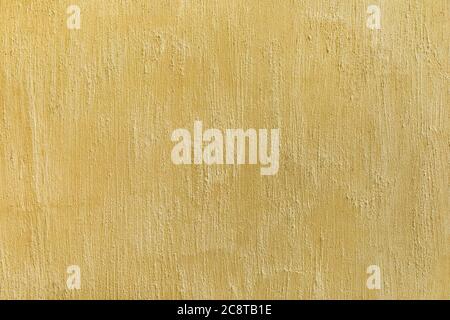 Decorative shabby plaster wall in beige color. Concrete scratched texture empty background. Stock Photo