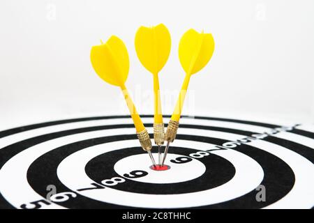 Close up shot of a dart board. Darts arrow Missing the target on a dart board during the game. Stock Photo