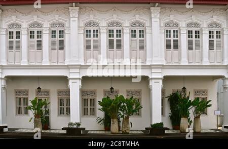 A row of restored white peranakan shophouses in the unesco world heritage town of George town, Penang. Stock Photo