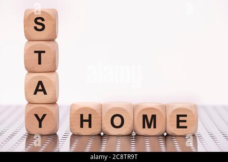 Stay home written on wooden cubes Stock Photo