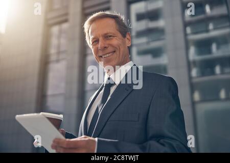 Handsome man using tablet computer on the street Stock Photo