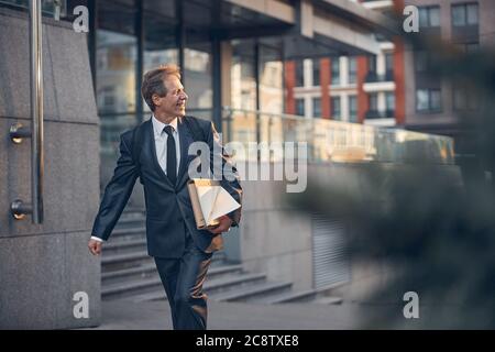 Handsome businessman in suit walking on the street Stock Photo