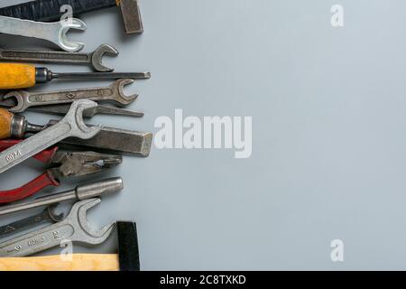 Happy Labor day concept Construction group home tools - hammer, saw, screwdriver, meter, pliers, wrench, chisel on gray background Holiday card Top Stock Photo