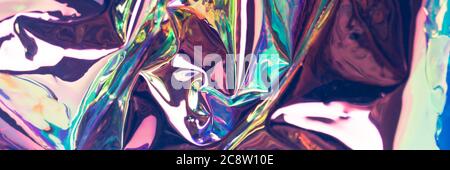 Multicolored glossy defocused hologram banner. Crumpled foil material. Pearlescent surreal texture. Stock Photo
