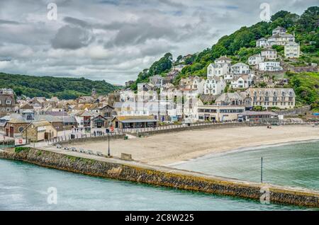 From West Looe looking across the river towards the East side showing the beach and town just before 'Lockdown' was eased ready for the holiday season Stock Photo