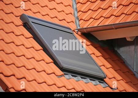 Roof window with roller shutter Stock Photo