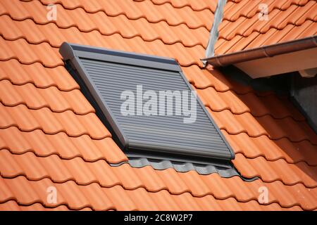 Roof window with roller shutter Stock Photo
