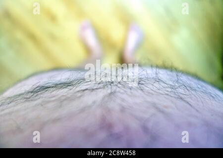 Obese mans point of view looking at his feet Stock Photo