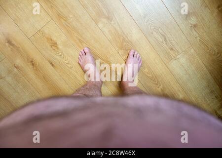 Obese mans point of view looking at his feet Stock Photo