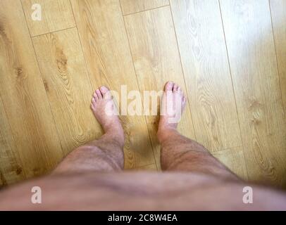 Obese mans point of view looking at his feet Stock Photo