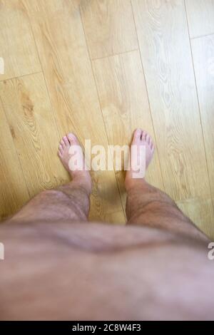 Obese mans point of view looking at his feet Stock Photo