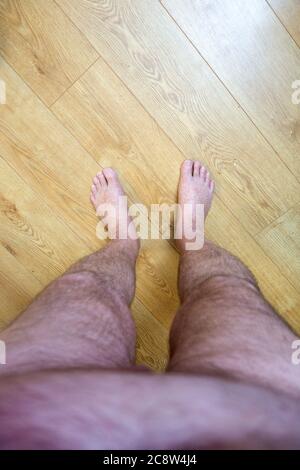 Obese mans point of view looking at his feet Stock Photo