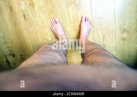 Obese mans point of view looking at his feet Stock Photo